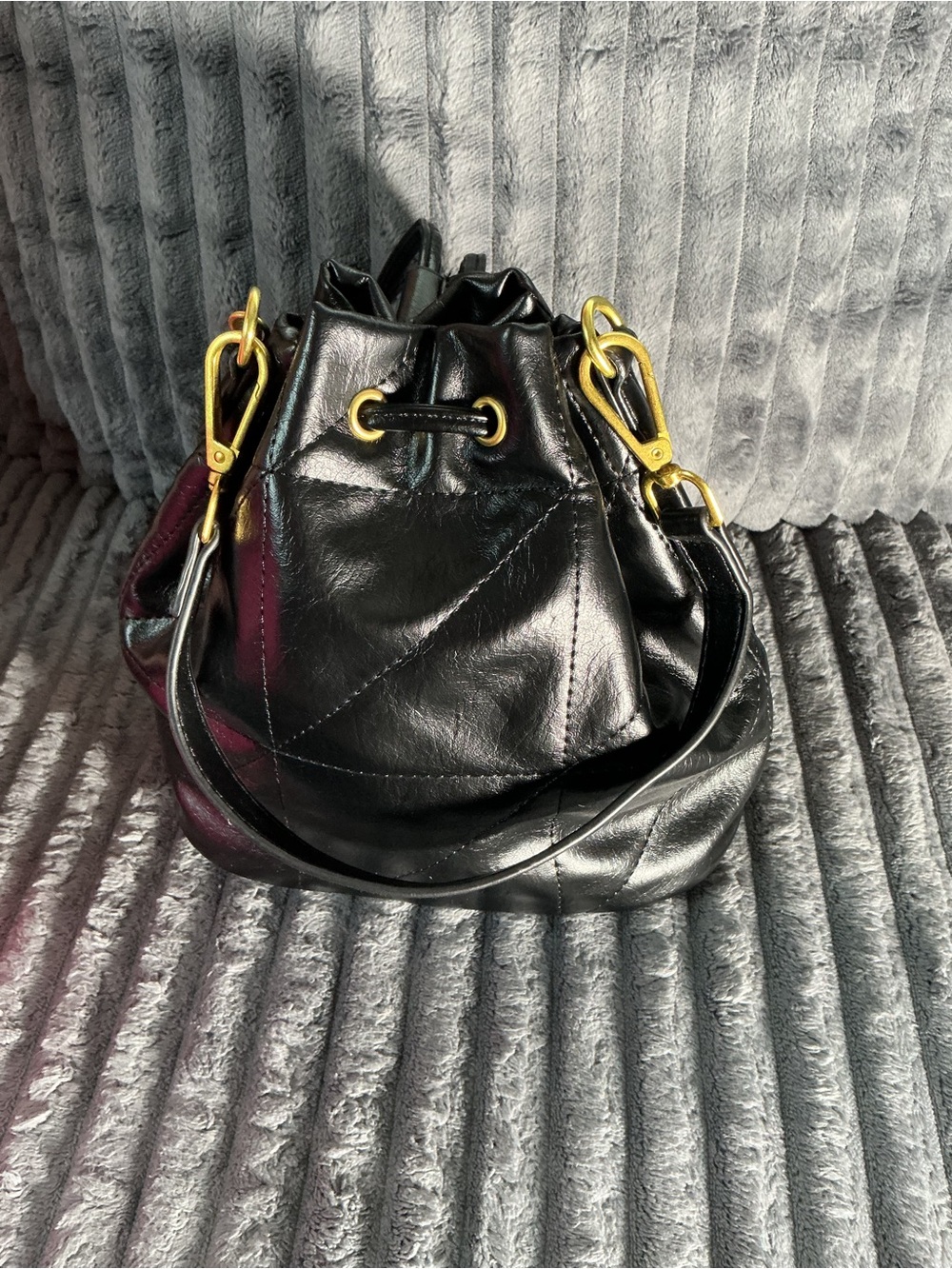 Black Leather Drawstring Shoulder Bag with Gold Hardware